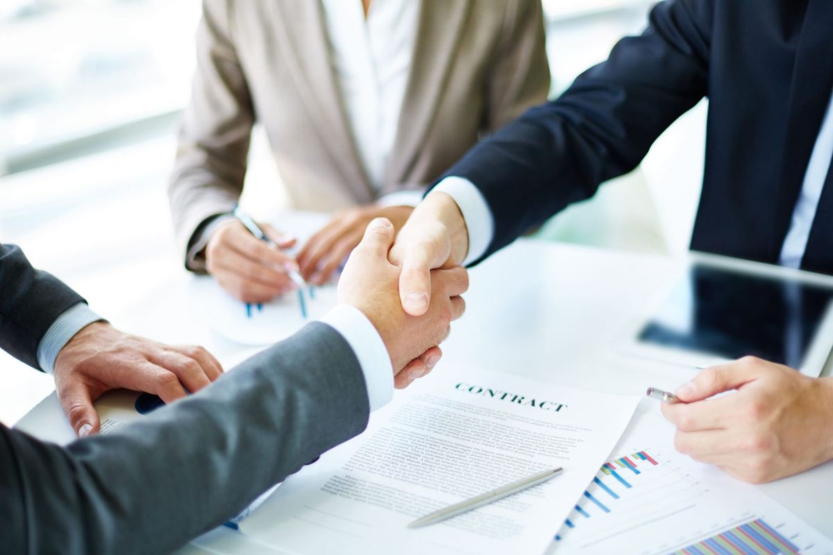 Business partners sealing an agreement with a handshake