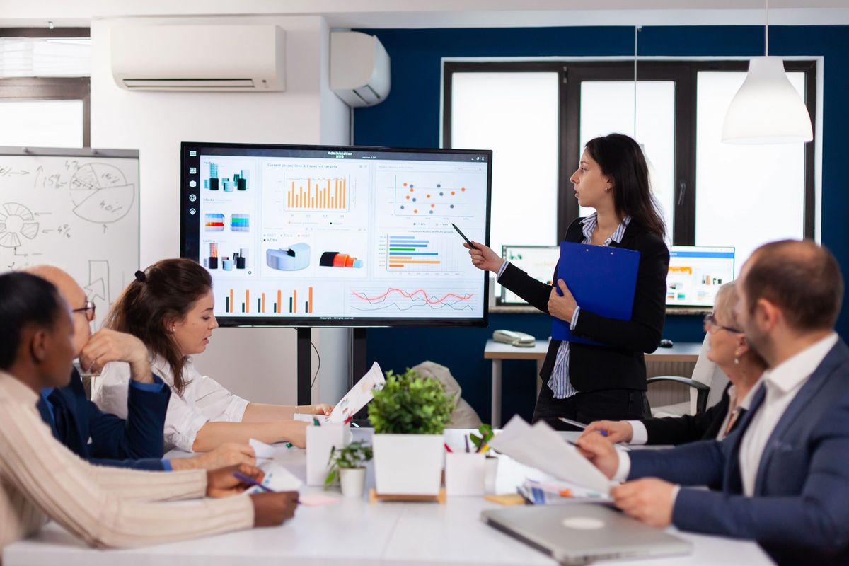 A team lead presenting a technology roadmap on a screen