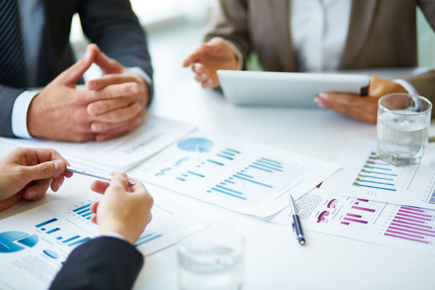 Consultants reviewing performance charts together at a table